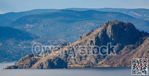Scenery view of rocky mountain slope over the lake in British Columbia.
