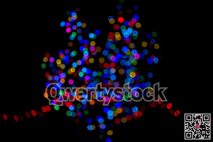 Colorful group of holiday lights on dark background of night.