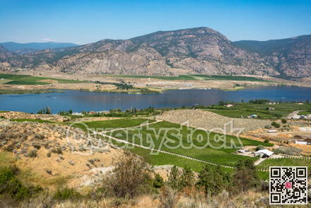 Okanagan valley panoramic view with residential area and orchard farm fields