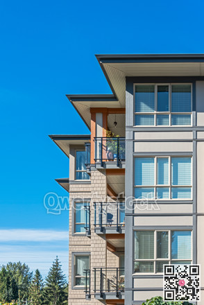 Corners of new residential building on blue sky background