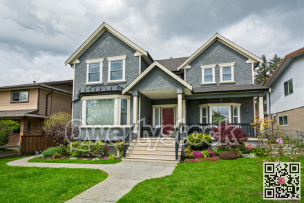 Nice family house with concrete pathway over green lawn over front yard