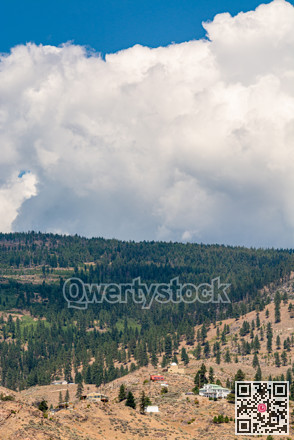 Summer mountains landscape on cloudy sky background
