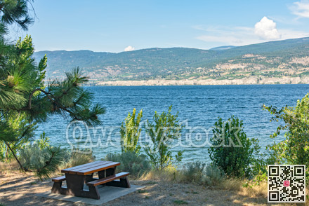 Recreation area with beautiful overview of a lake and mountains.