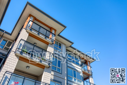 Corners of new residential building on blue sky background
