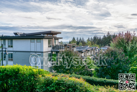 Top of residential building on cloudy sky background