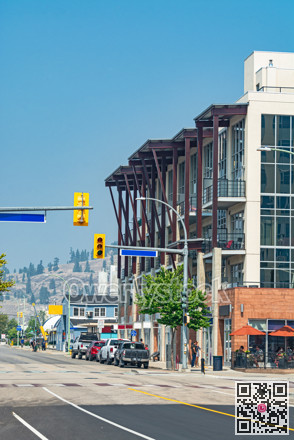 City street view with modern residential building on site