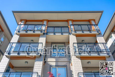 Top levels of new residential building on blue sky background