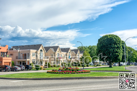 Row of nice residential townhouses with private entrance from the street