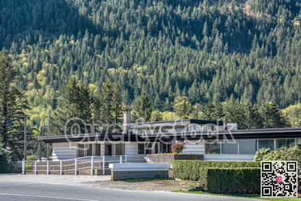 A perfect neighbourhood. Office building on mountain slope background