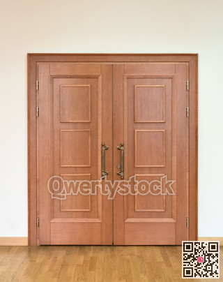 Wooden doors with bronze handles in a concourse