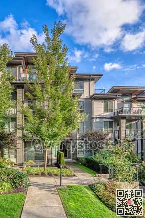 Residential apartment building on blue sky background