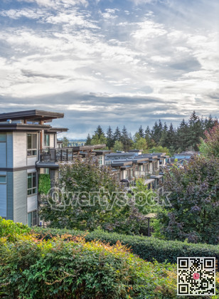 Top of residential building on cloudy sky background