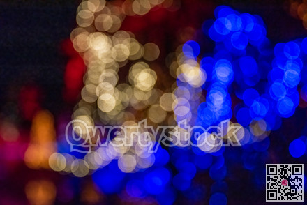 Colorful group of holiday lights on dark background of night.