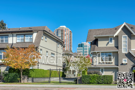 Residential apartment buildings on blue sky background