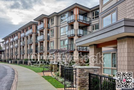 Residential apartment building with walking pathway in front