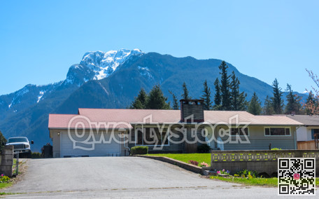 Mountain landscape overview with residential house in front
