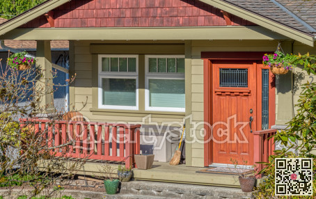 Entrance door of residential house with small porch in front