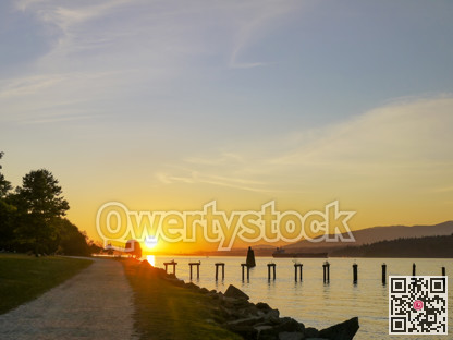 Waterfront walkway in Vancouver harbor on summer sunset