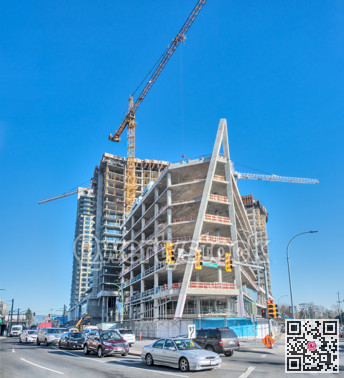 New building under construction on a city street intersection