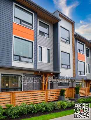 Brand new townhouses for sale. Row of new townhomes on blue sky background