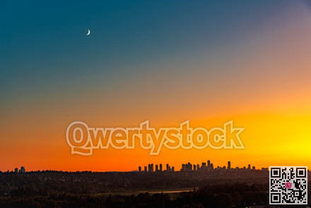 Metrotown district under the moon on sunset sky background
