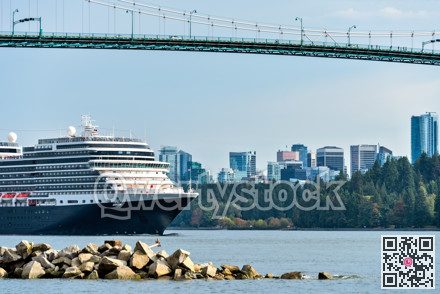 Huge ocean cruise ship passing under Lion Gates Bridge in Vancouver, Canada