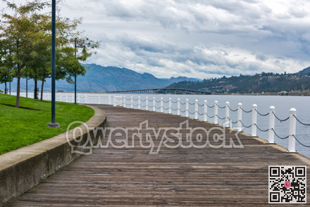 Wooden boardwalk along the waterfront on Okanagan lake in British Columbia