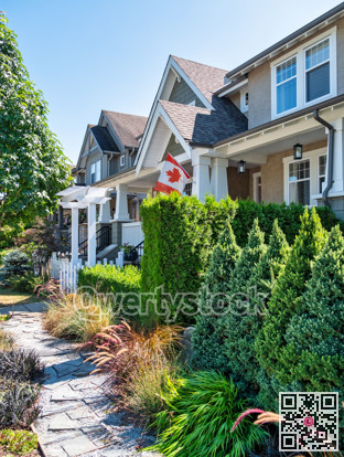 A row of residential townhouses on summer sunny day