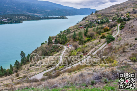 Large luxury houses on the lake shore with view at Kalamalka lake