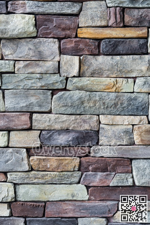 Decorative brown and grey stone setting. Cut stone wall texture.