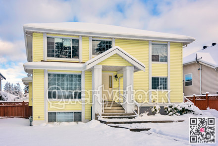 Yellow residential house on winter season in Vancouver, Canada