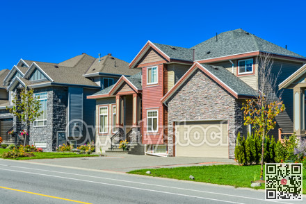 New family house with concrete driveway and asphalt road in front.
