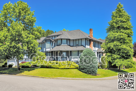 Big residential house on the street with brick chimney and steps on front yard