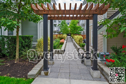 Walkway in residential area between two rows of townhouses