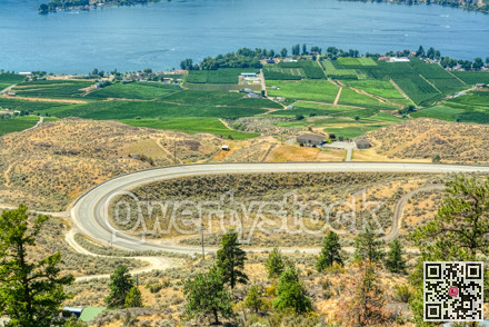 C-shape road in Okanagan valley on summer day