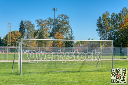 Empty football gate on blue sky background