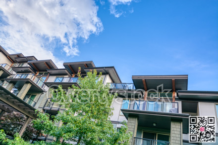 Raising roofs of residential building on blue sky backdrop