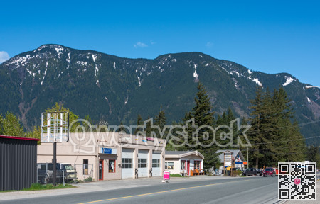 Street of small canadian town on snow mountain and blue sky background