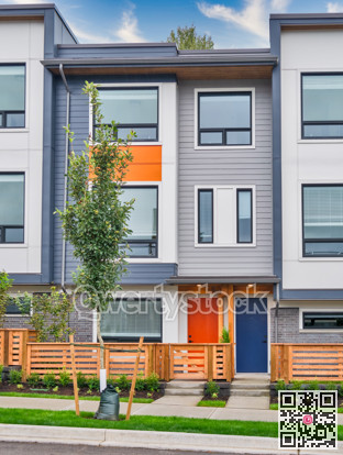 Red and blue doors of brand new residential townhouses