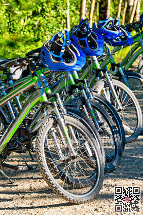 Rental bikes and helmets ready for adventure tour