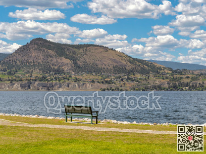 Scenery Okanagan lake overview with the bench at the waterfront