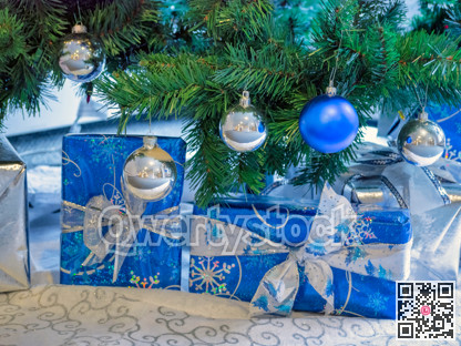 Ornate Santa Claus gift boxes under the christmas tree with decorative balls