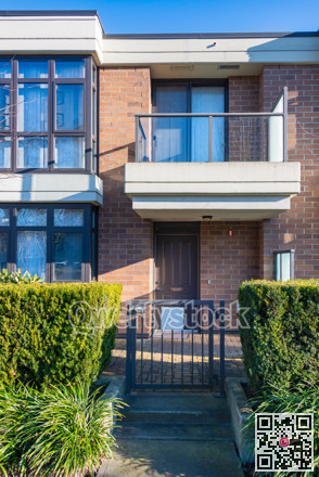 Street entrance at residential townhouse on sunny winter day