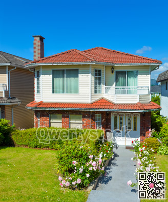 Average family house with concrete pathway to the entrance.