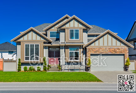 Suburban family house with green lawn in front