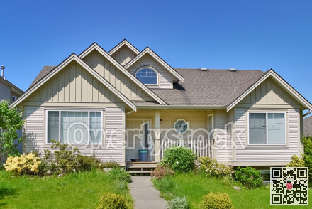 Average residential house in Canada on blue sky background