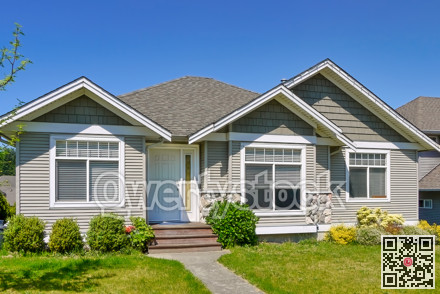 Average residential house in Canada on blue sky background