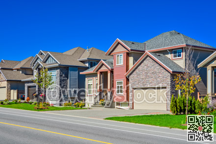 Suburban family house with green lawn in front