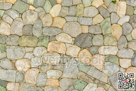 Wall built with natural stones. Natural rocks texture background.