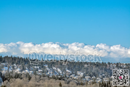 Residential houses in suburban area on cloudy sky background
